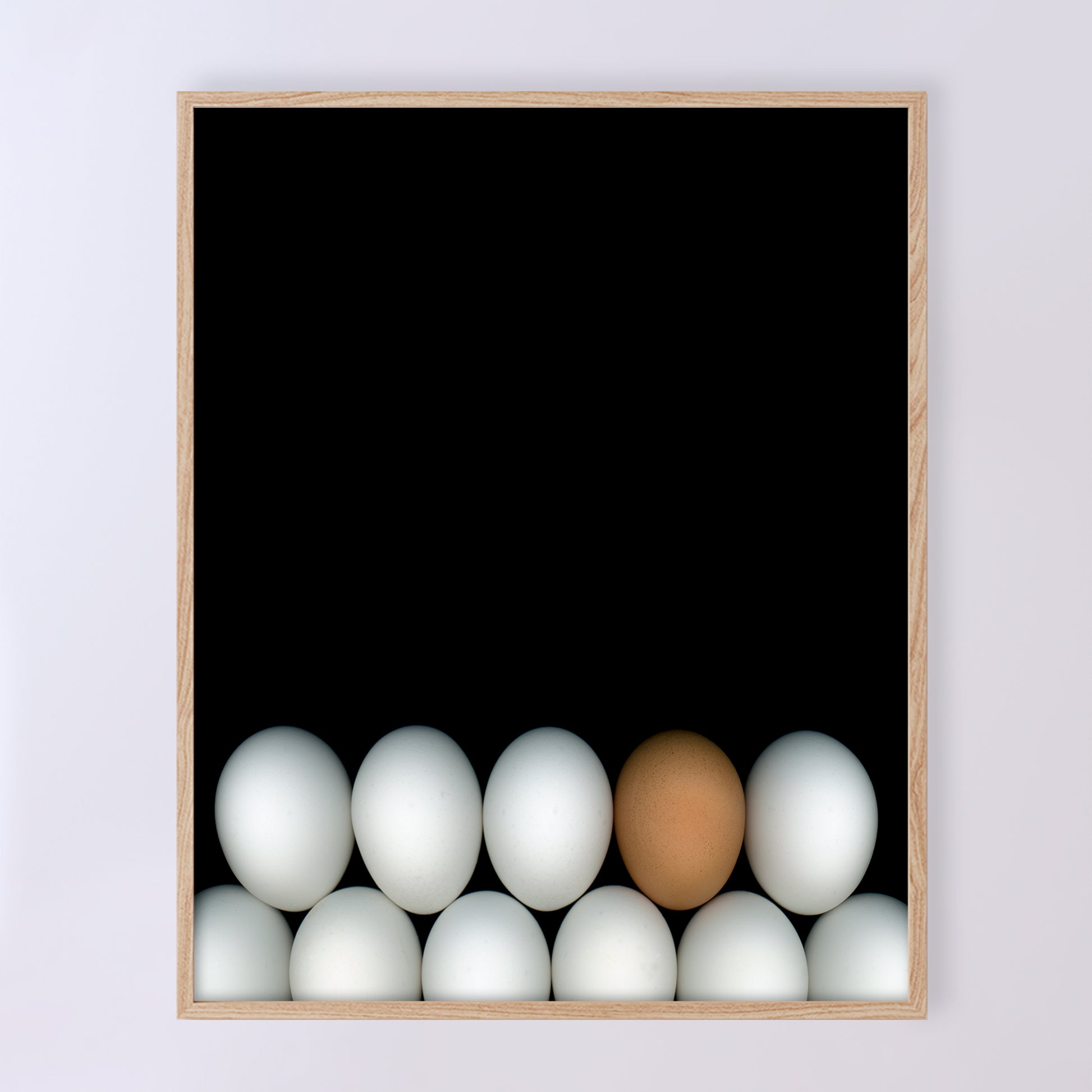 Two rows of white chicken eggs with one brown egg  on a black background. Open edition 8x10 inches print by Carmen Grenier. OE-354-1