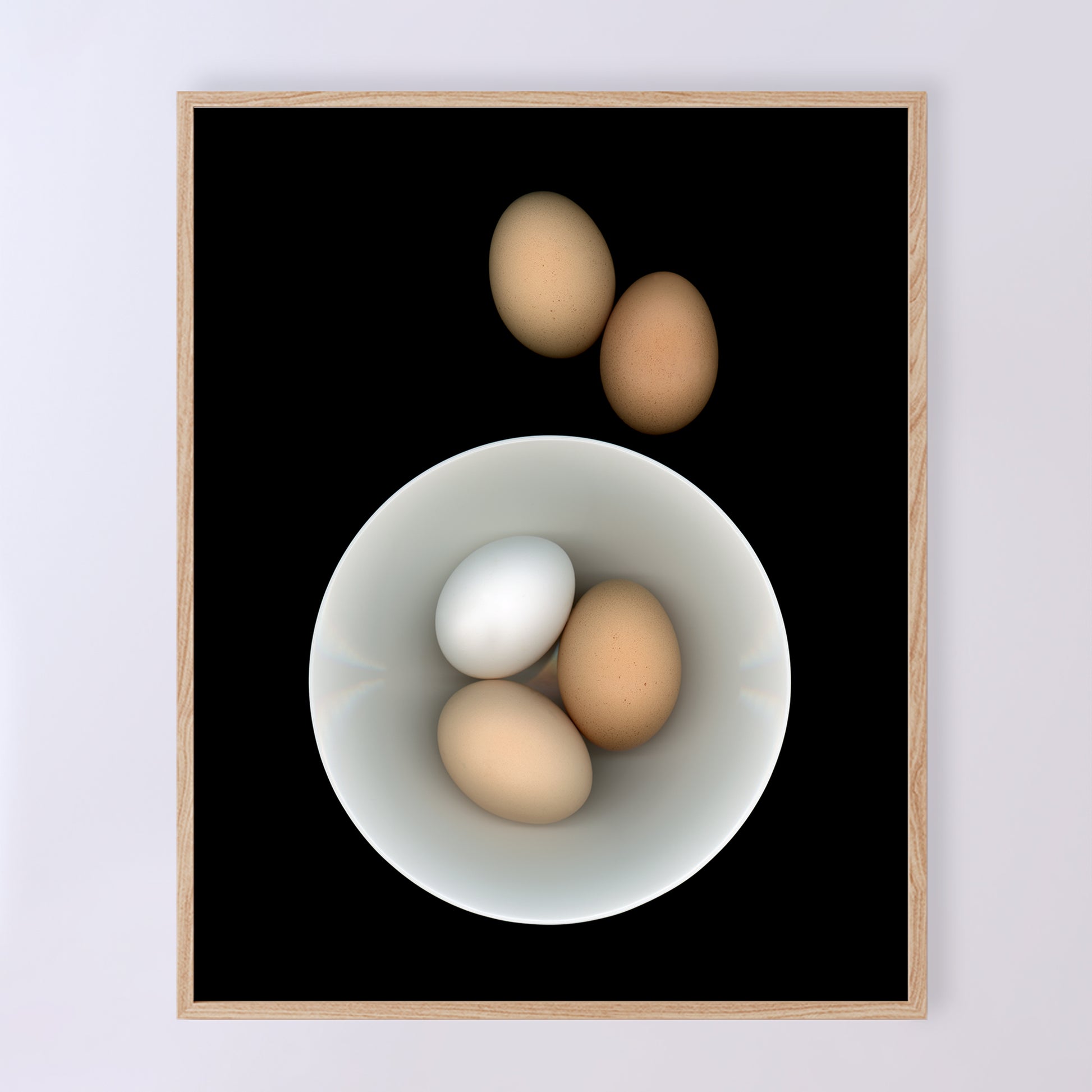 Breakfast anyone? Three eggs in a white bowl with two brown egg on the side on a black background. Open edition 8x10 inches print by Carmen Grenier. OE-353-1