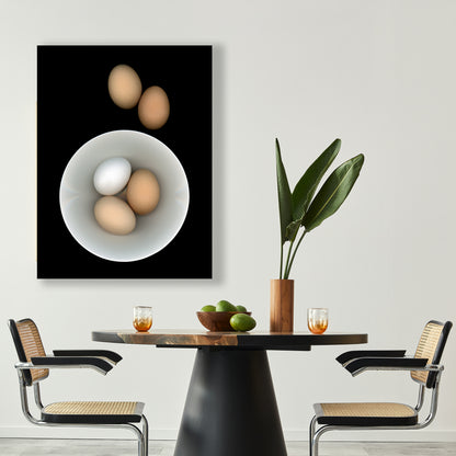 Breakfast anyone? Three eggs in a white bowl with two brown egg on the side on a black background. Open edition print in a dining setting by Carmen Grenier. OE-353.