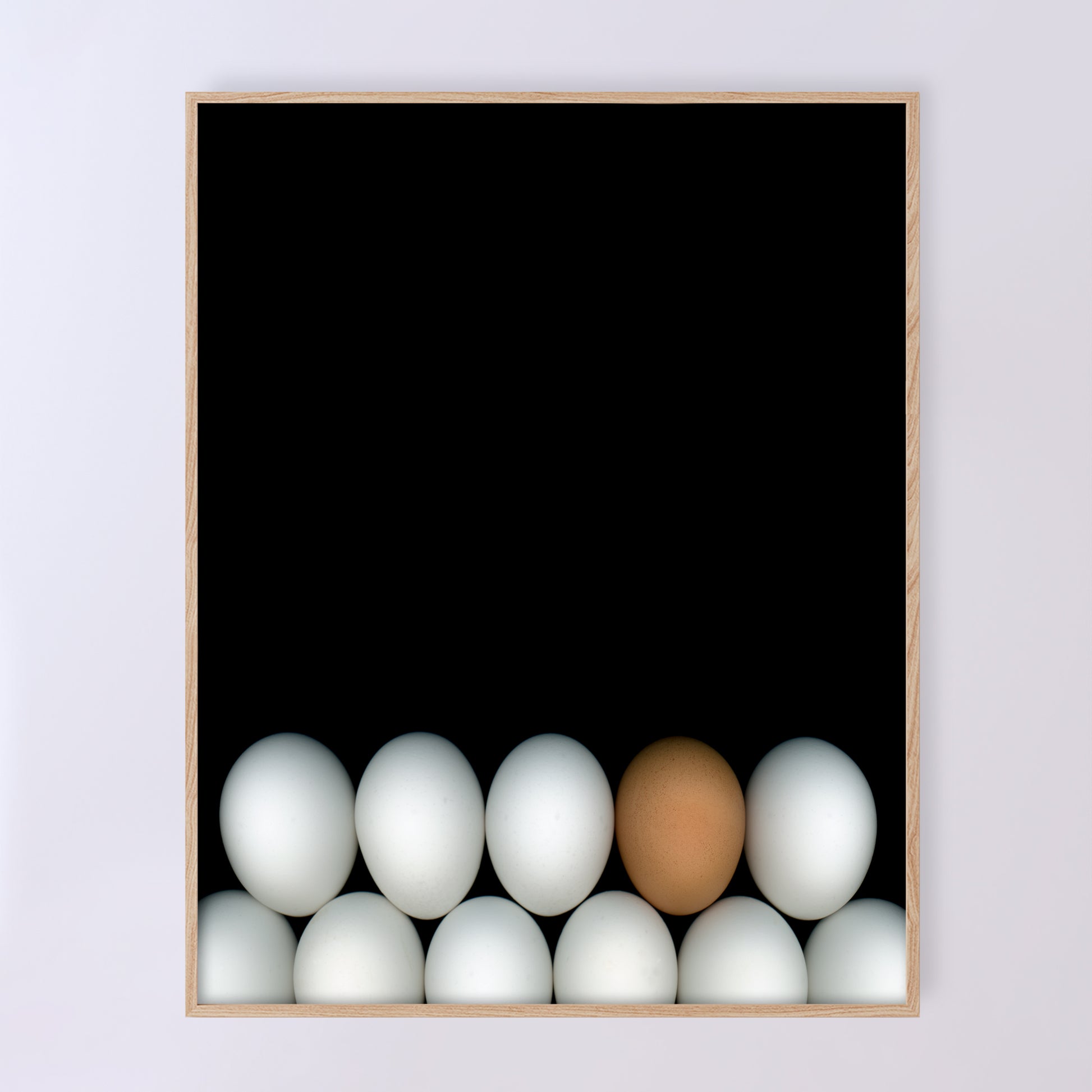 Two rows of white chicken eggs with one brown egg  on a black background. Open edition 11x14 inches print by Carmen Grenier. OE-354-2